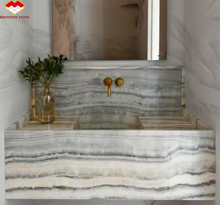 Painel de parede do banheiro do hotel e bacia de vaidade com lavatório feito de pedra natural mármore de ônix